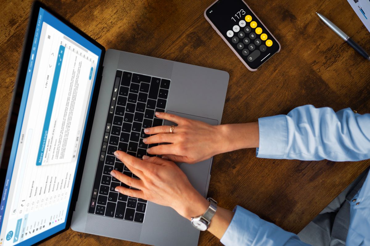 Top view woman typing laptop
