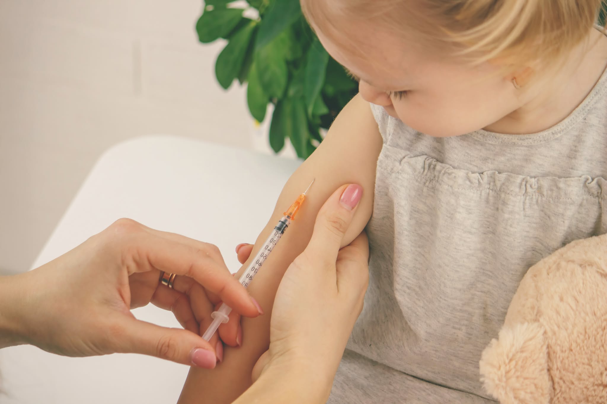 Doctor vaccinating a small child. Pediatrician giving an injection.vaccine.