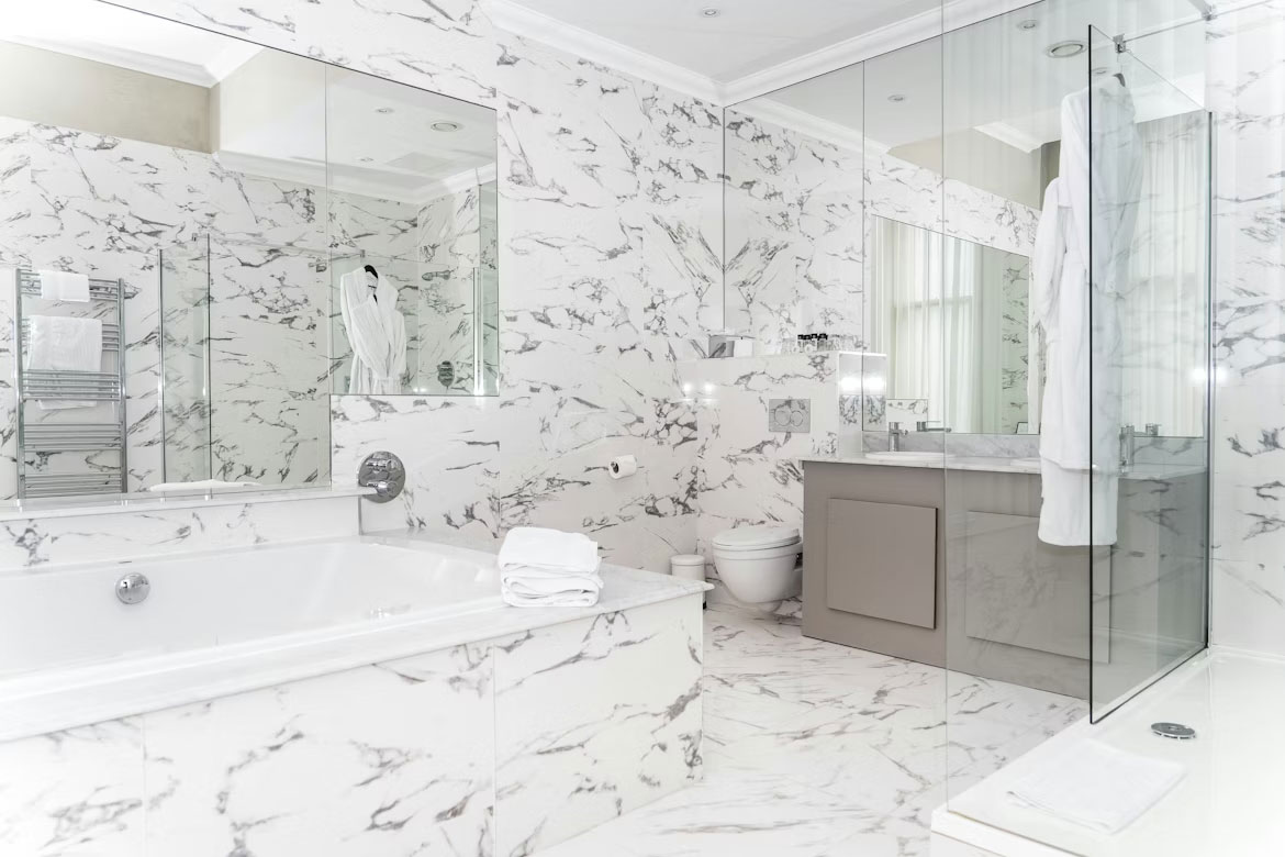 Uxurious marble bathroom with bathtub and vanity