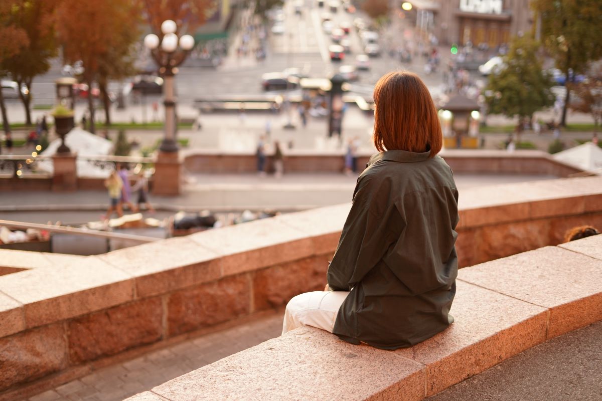 Woman sunset with amazing city view enjoying warm days freedom positive vibes
